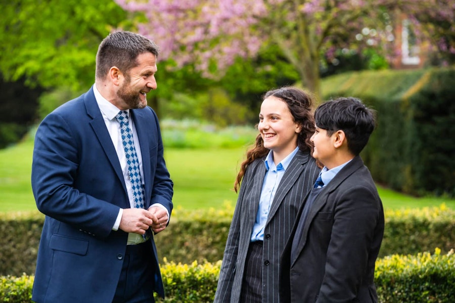 Mr Gregory with two pupils